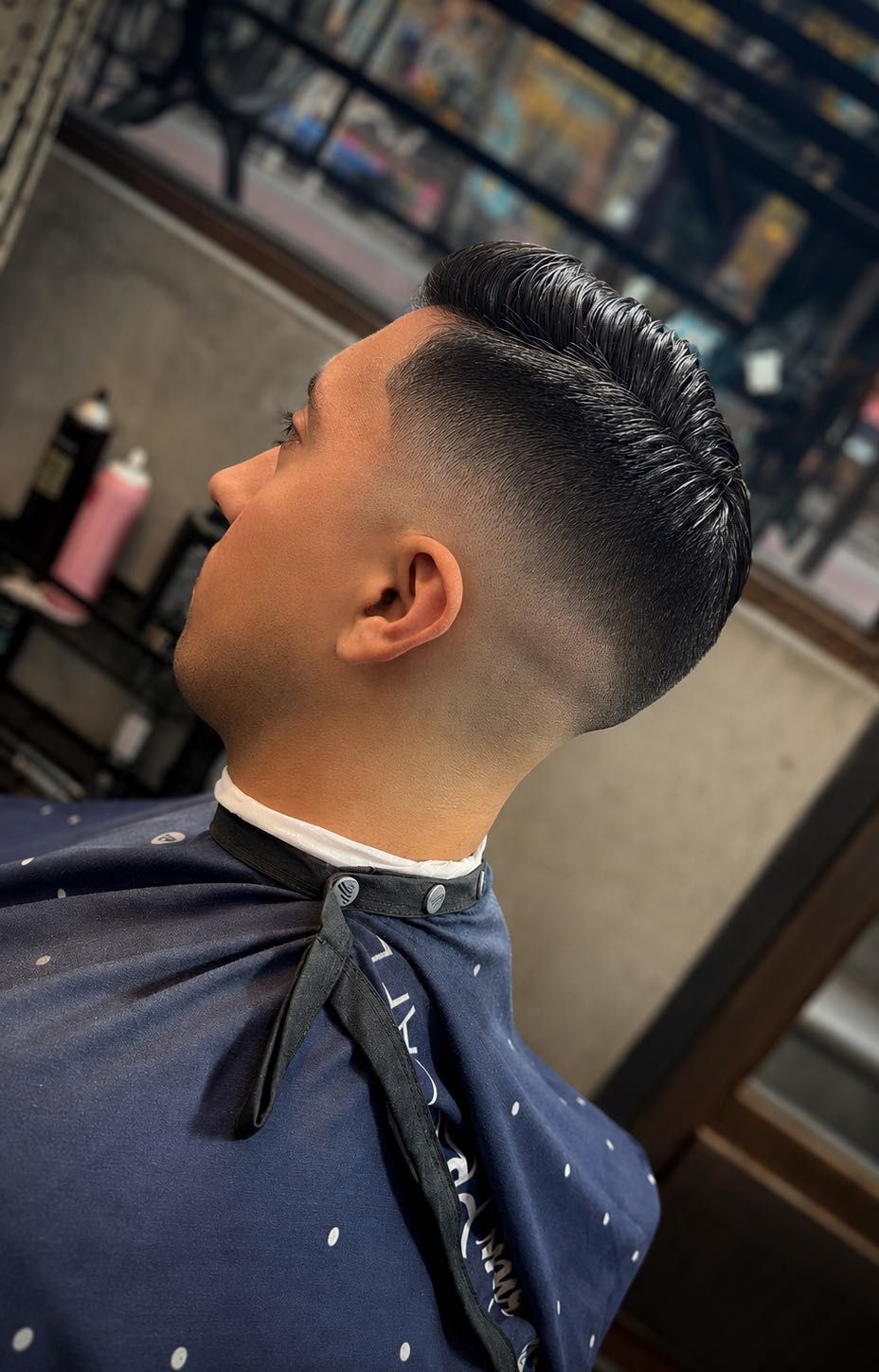 Clean mid fade haircut at CrisBarberNYC, 127 Allen St
