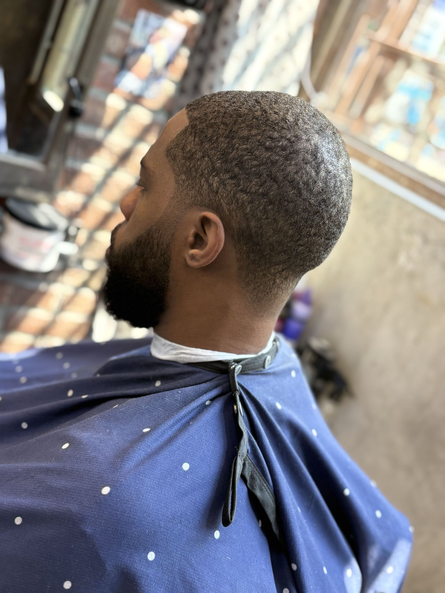 Sharp taper fade by Cristian Alonso at CrisBarberNYC NYC